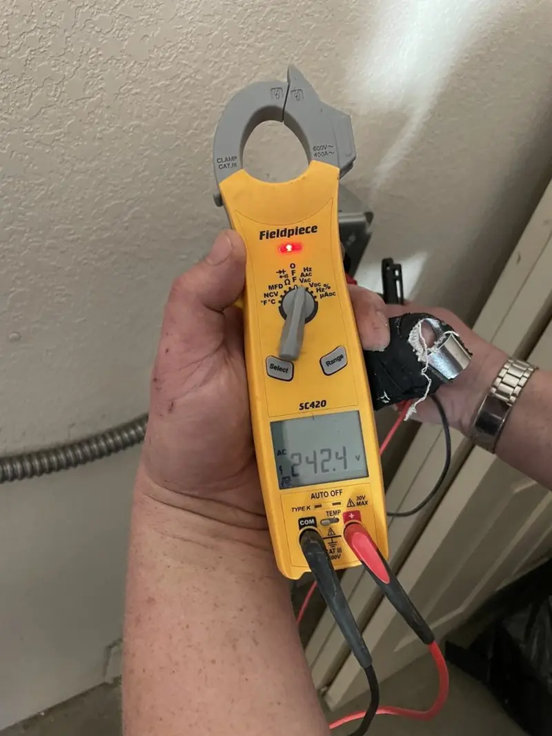 Voltage testing with clamp meter during Recessed Lighting Installation in Olympia Fields